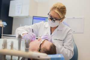 Lindner Dentist operating on Patients teeth